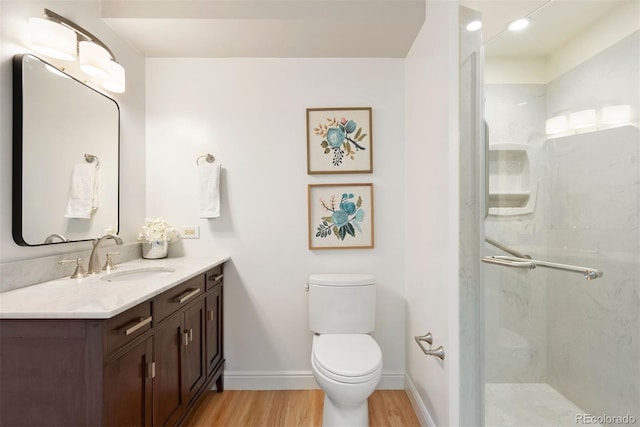 695 S Alton Way Unit 9C, Denver, CO 80247 - bathroom with wood finished floors, vanity, and a stall shower