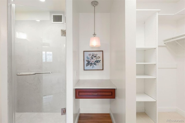 695 S Alton Way Unit 9C, Denver, CO 80247 - bathroom with a shower stall and a closet