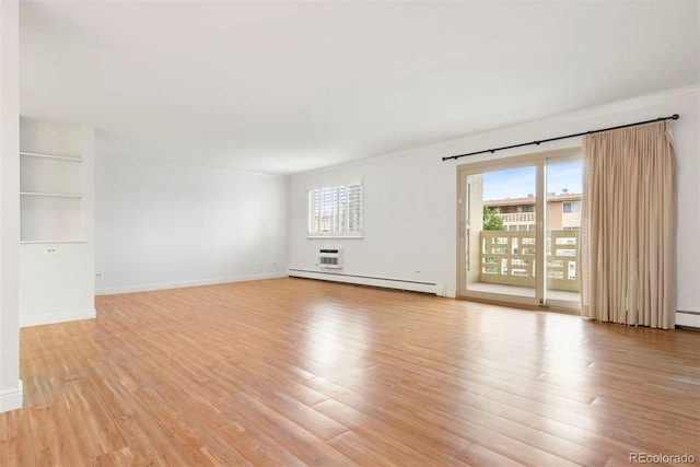 695 S Alton Way Unit 9C, Denver, CO 80247 - spare room with a baseboard radiator, light wood-style floors, and ornamental molding