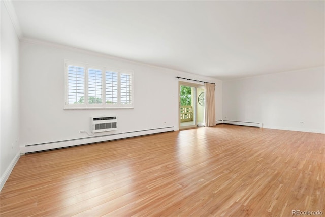 695 S Alton Way Unit 9C, Denver, CO 80247 - unfurnished room with a baseboard radiator, crown molding, light wood-style floors, and a wall mounted AC