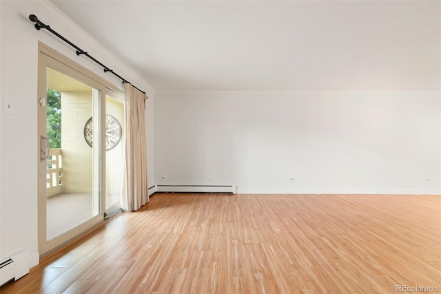 695 S Alton Way Unit 9C, Denver, CO 80247 - spare room with a baseboard radiator, light wood-style flooring, and crown molding