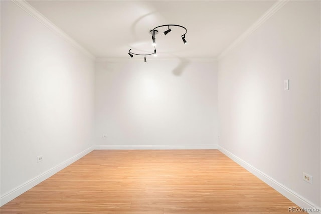 695 S Alton Way Unit 9C, Denver, CO 80247 - spare room with crown molding and light wood finished floors