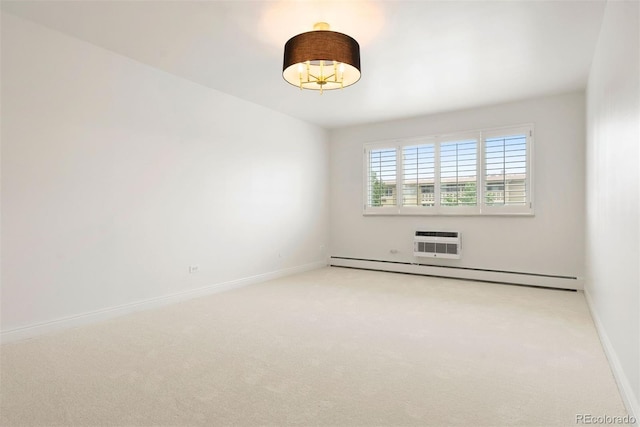 695 S Alton Way Unit 9C, Denver, CO 80247 - empty room featuring a baseboard radiator and light carpet