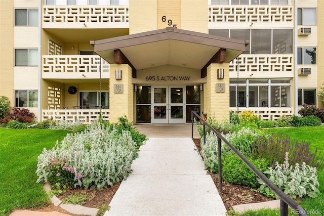 695 S Alton Way Unit 9C, Denver, CO 80247 - property entrance with an AC wall unit