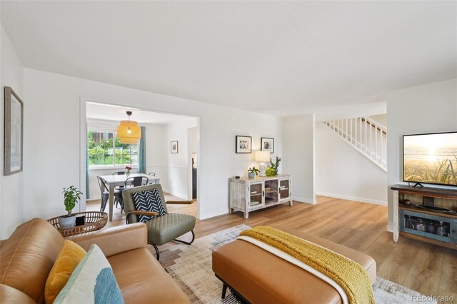 841 Beech St, Golden, CO 80401 - living area featuring stairway and wood finished floors