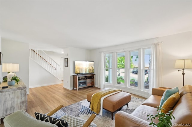 841 Beech St, Golden, CO 80401 - living area with light wood-style flooring and stairway