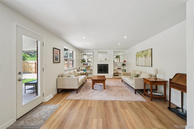 841 Beech St, Golden, CO 80401 - living area with light wood-style flooring, a glass covered fireplace, and recessed lighting