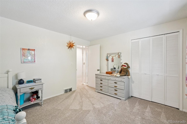 841 Beech St, Golden, CO 80401 - bedroom with carpet floors, a closet, and a textured ceiling