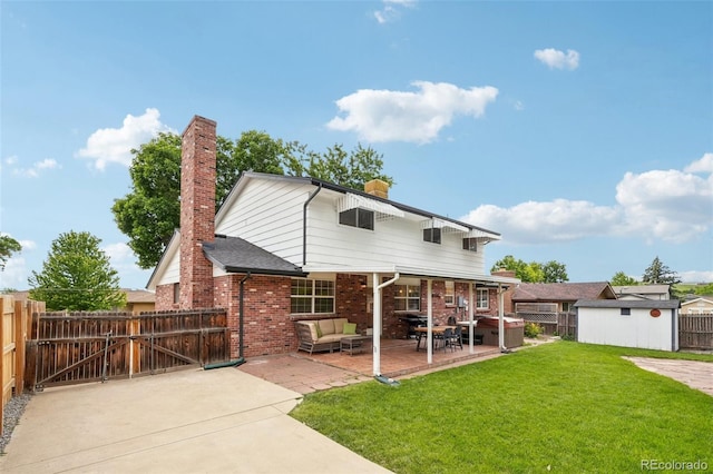 841 Beech St, Golden, CO 80401 - back of property with a hot tub, a chimney, a fenced backyard, and a patio