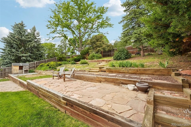 841 Beech St, Golden, CO 80401 - fenced backyard with a vegetable garden, a patio, and an outdoor structure