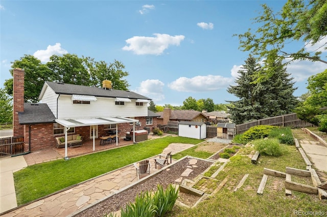 841 Beech St, Golden, CO 80401 - rear view of house with a patio, brick siding, a chimney, and a fenced backyard