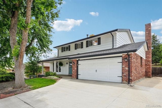841 Beech St, Golden, CO 80401 - traditional home featuring concrete driveway, brick siding, a chimney, and covered porch