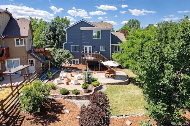 3357 Holly Hock Ct, Castle Rock, CO 80109 - back of property featuring a patio area, a wooden deck, and an outdoor hangout area