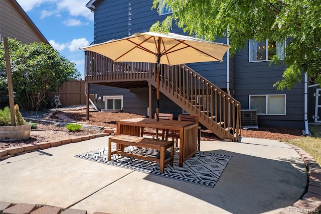 3357 Holly Hock Ct, Castle Rock, CO 80109 - view of patio with outdoor dining space, stairway, and a wooden deck