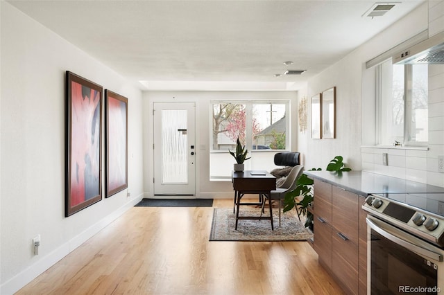 401 S Ivy St, Denver, CO 80224 - foyer with light wood finished floors, plenty of natural light, and baseboards