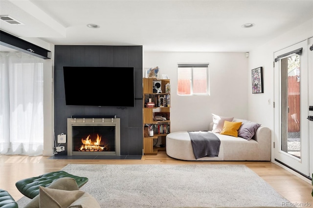 401 S Ivy St, Denver, CO 80224 - living area with healthy amount of natural light, wood finished floors, a large fireplace, and recessed lighting