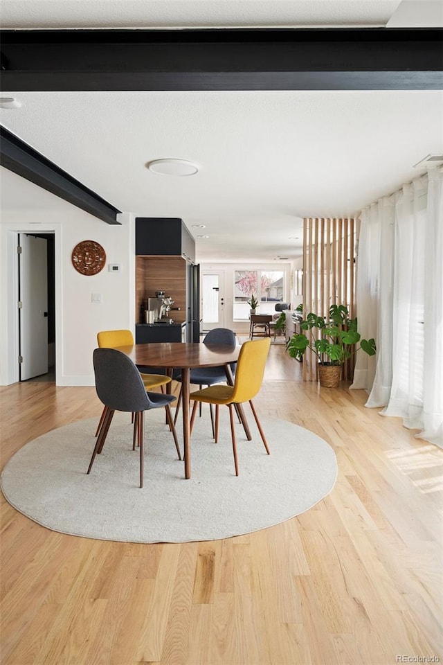 401 S Ivy St, Denver, CO 80224 - dining space with wood finished floors, beam ceiling, and baseboards