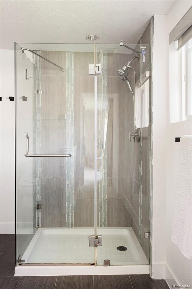 401 S Ivy St, Denver, CO 80224 - full bathroom with a shower stall and baseboards