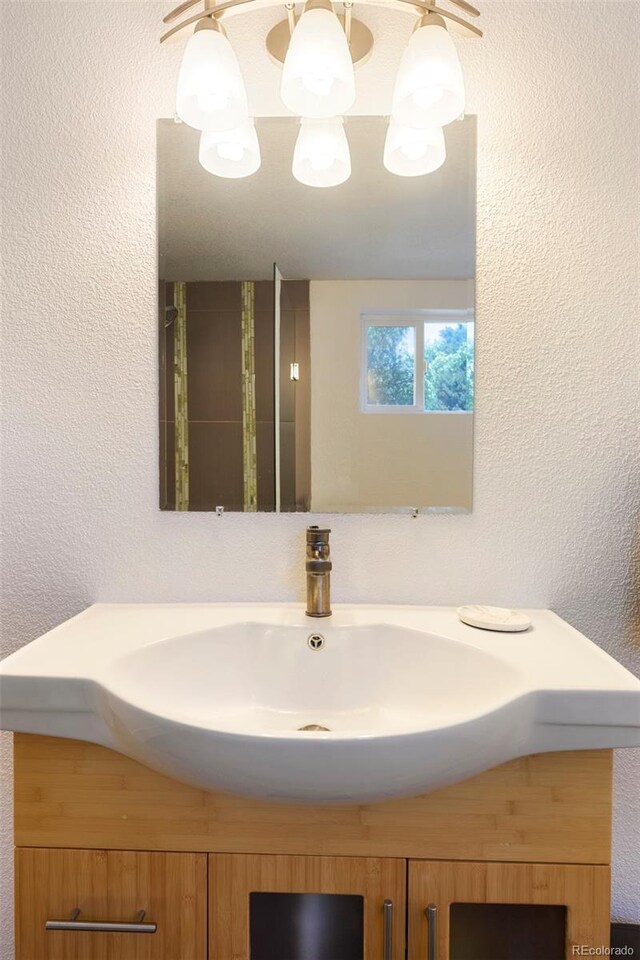 401 S Ivy St, Denver, CO 80224 - bathroom featuring a textured wall and vanity
