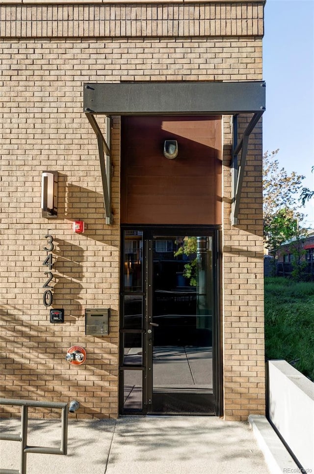 3420 W 32nd Ave Unit 203, Denver, CO 80211 - doorway to property with brick siding