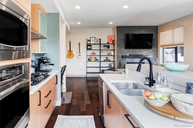 3420 W 32nd Ave Unit 203, Denver, CO 80211 - kitchen featuring stainless steel appliances, light countertops, recessed lighting, dark wood-style floors, and open floor plan