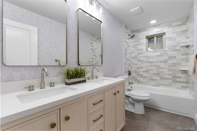 bathroom featuring tile patterned flooring, a sink, toilet, and  shower combination