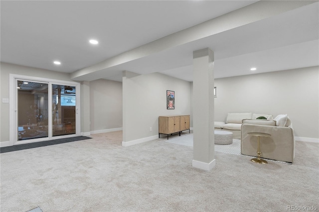 carpeted living area featuring baseboards and recessed lighting