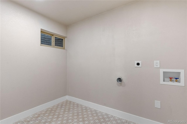 clothes washing area with laundry area, baseboards, hookup for a washing machine, light floors, and electric dryer hookup