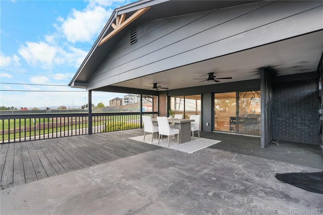 deck featuring a ceiling fan and outdoor dining space