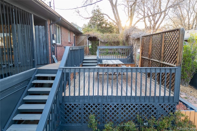 wooden terrace featuring stairs