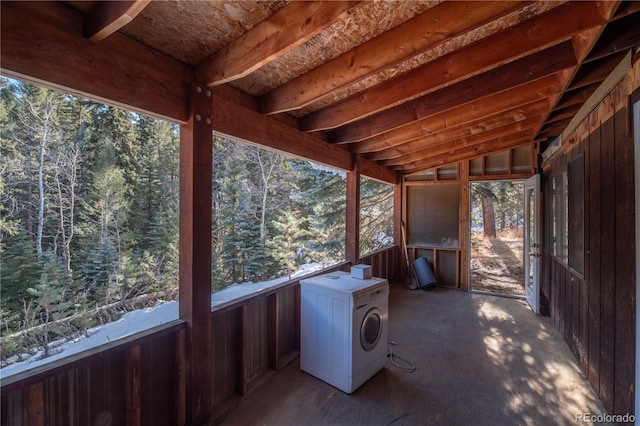 unfurnished sunroom featuring washer / clothes dryer