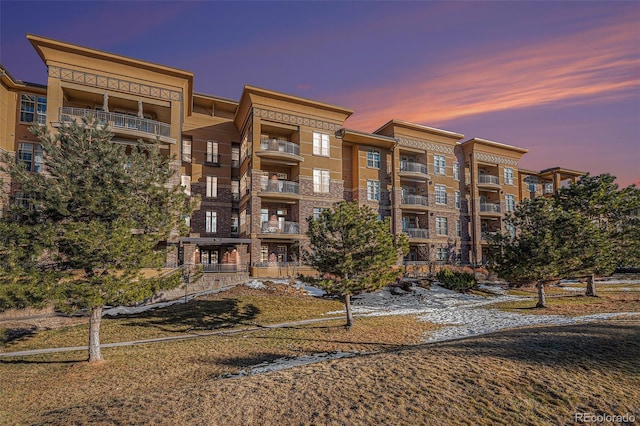 view of outdoor building at dusk