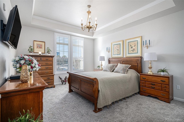 carpeted bedroom featuring crown molding, a raised ceiling, and a chandelier