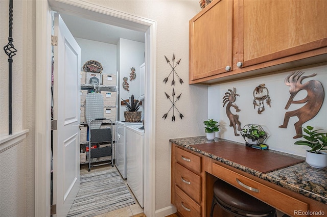 washroom featuring washing machine and dryer and light tile patterned floors