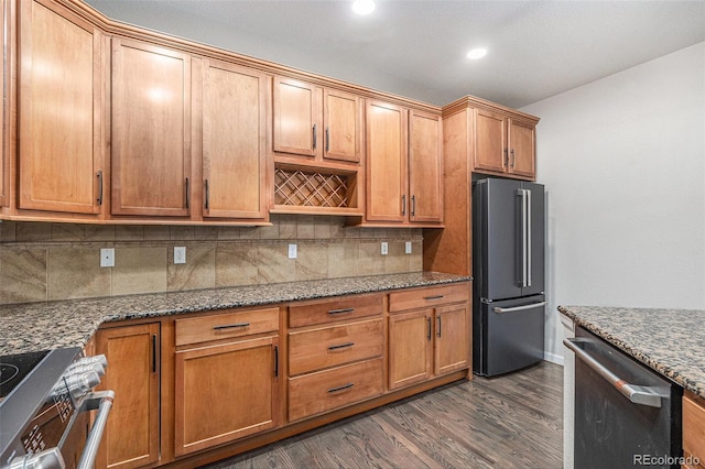 7865 Vallagio Ln Unit 308, Englewood, CO 80112 - kitchen featuring high quality fridge, dishwasher, range, backsplash, and dark wood-type flooring