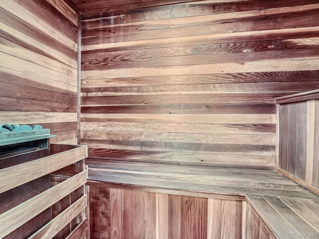 view of sauna / steam room with wooden walls