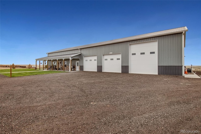 detached garage featuring driveway