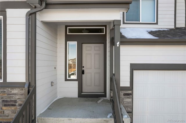 entrance to property featuring a garage