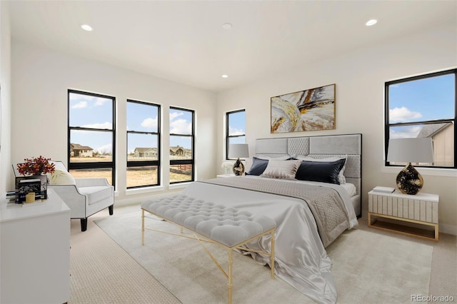 1877 Spring Bloom Dr, Windsor, CO 80550 - bedroom featuring light carpet and recessed lighting