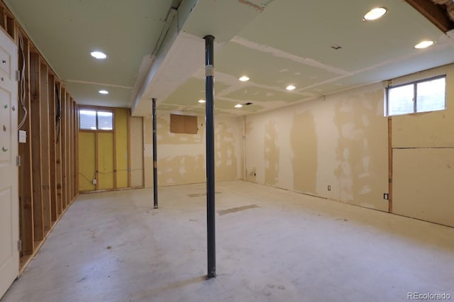 basement with recessed lighting and a wealth of natural light