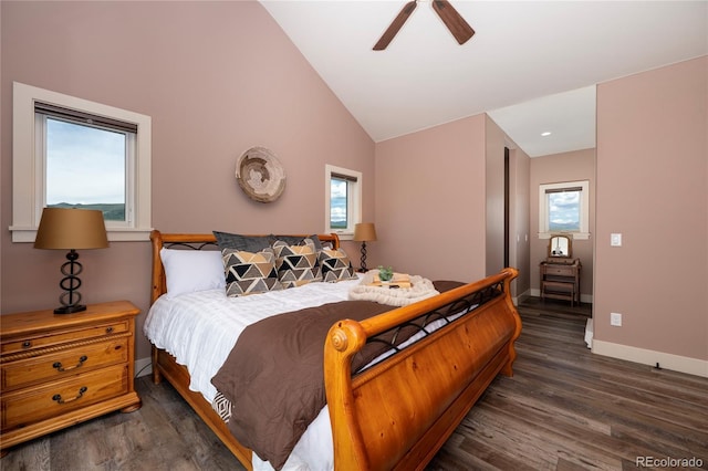 251 Grand Elk Way, Granby, CO 80446 - bedroom featuring dark wood-style floors, vaulted ceiling, multiple windows, and a ceiling fan