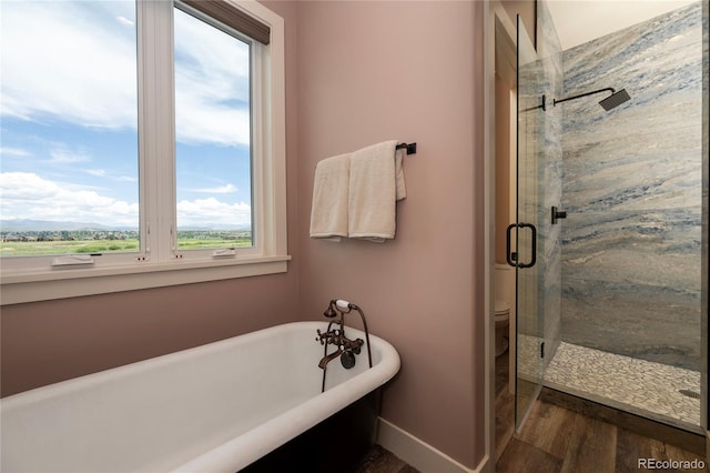 251 Grand Elk Way, Granby, CO 80446 - full bathroom with a stall shower, a freestanding bath, and wood finished floors