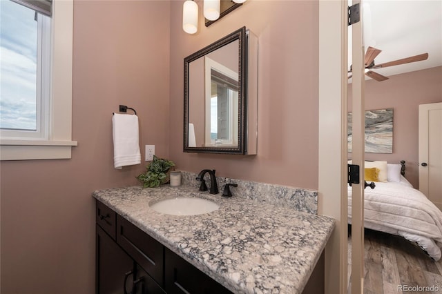 251 Grand Elk Way, Granby, CO 80446 - ensuite bathroom featuring vanity, a ceiling fan, and wood finished floors