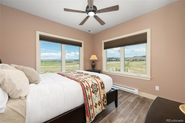 251 Grand Elk Way, Granby, CO 80446 - bedroom featuring baseboard heating, wood finished floors, and ceiling fan