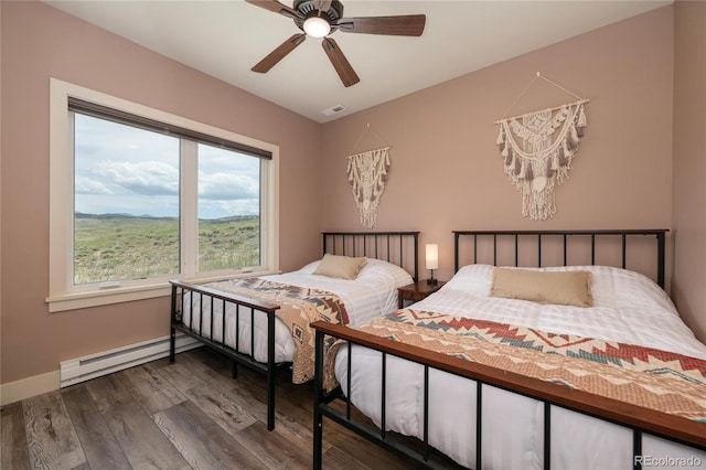 251 Grand Elk Way, Granby, CO 80446 - bedroom featuring a baseboard radiator, wood finished floors, and ceiling fan