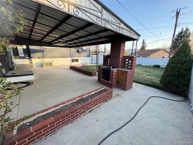 view of patio / terrace featuring fence