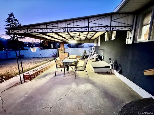 view of patio / terrace featuring fence and outdoor dining area