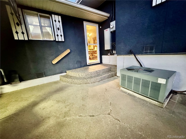 property entrance featuring central AC