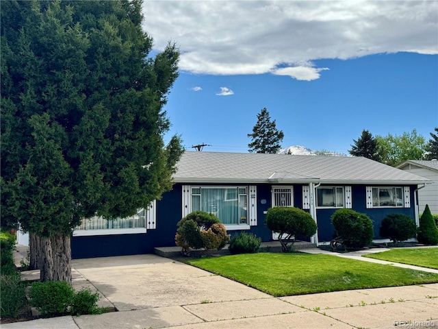 3498 Corbett Ln, Colorado Springs, CO 80907 - view of front of house featuring a front yard and driveway