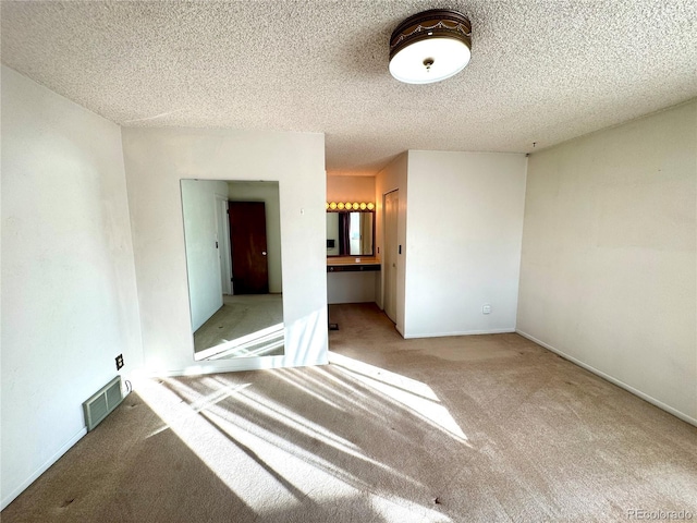 3498 Corbett Ln, Colorado Springs, CO 80907 - spare room with carpet and a textured ceiling
